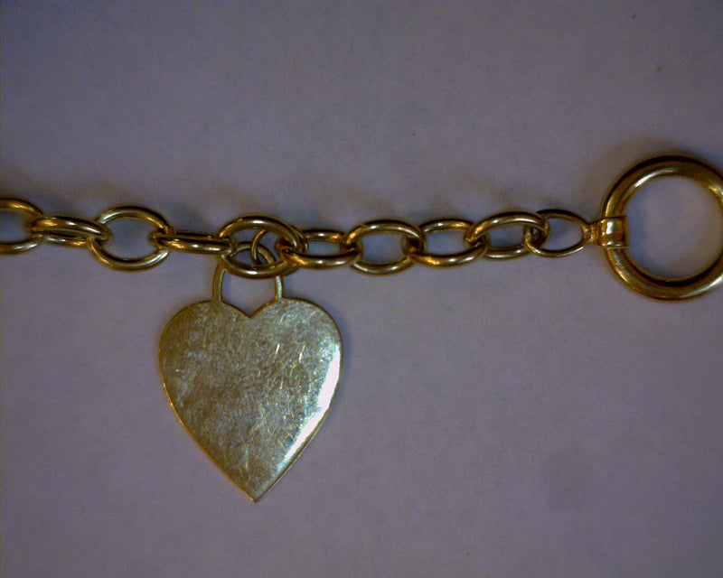 14K YG CHARM BRACELET 12.4 GRA